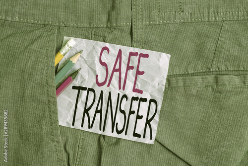Conceptual hand writing showing Safe Transfer. Concept meaning Wire Transfers electronically Not paper based Transaction Writing equipment and purple note paper inside pocket of trousers
