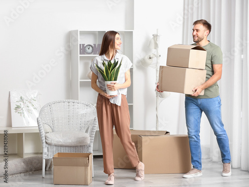 Happy young couple with bel...