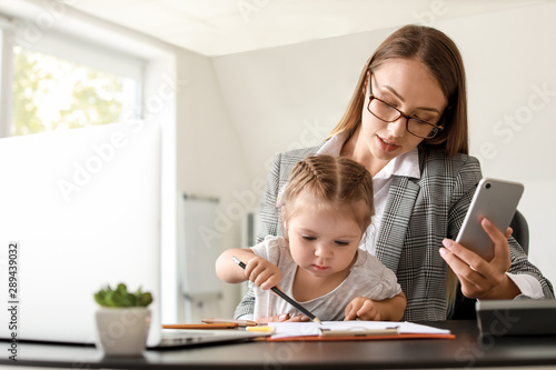 Working mother with her dau...