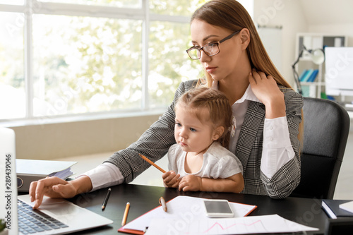 Working mother with her dau...
