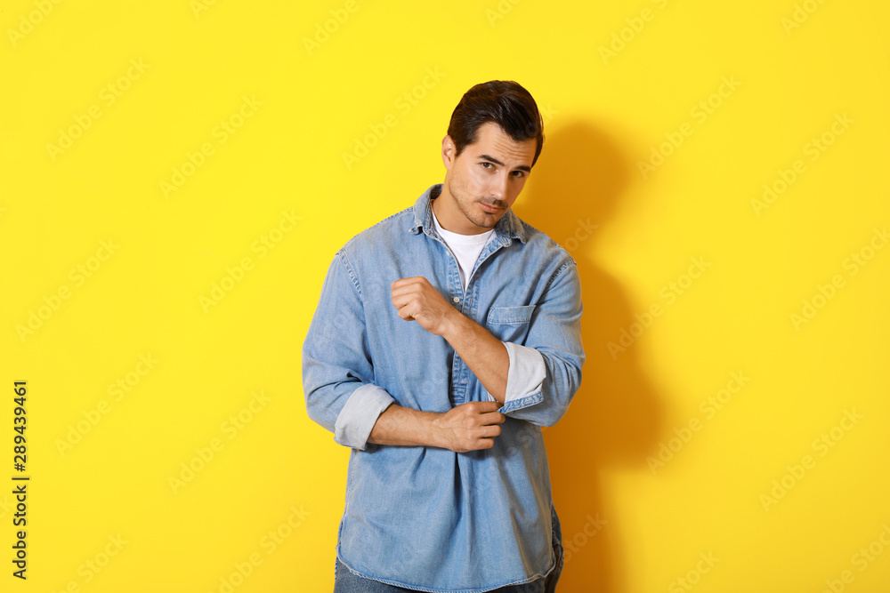 Stylish fashionable man on color background Stylish fashionable man on color background
