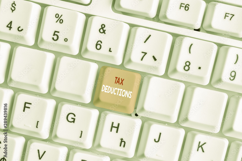 Writing note showing Tax Deductions. Business concept for an amount or cost that subtracted from someone s is income White pc keyboard with note paper above the white background Writing note showing Tax Deductions. Business concept for an amount or cost that subtracted from someone s is income White pc keyboard with note paper above the white background