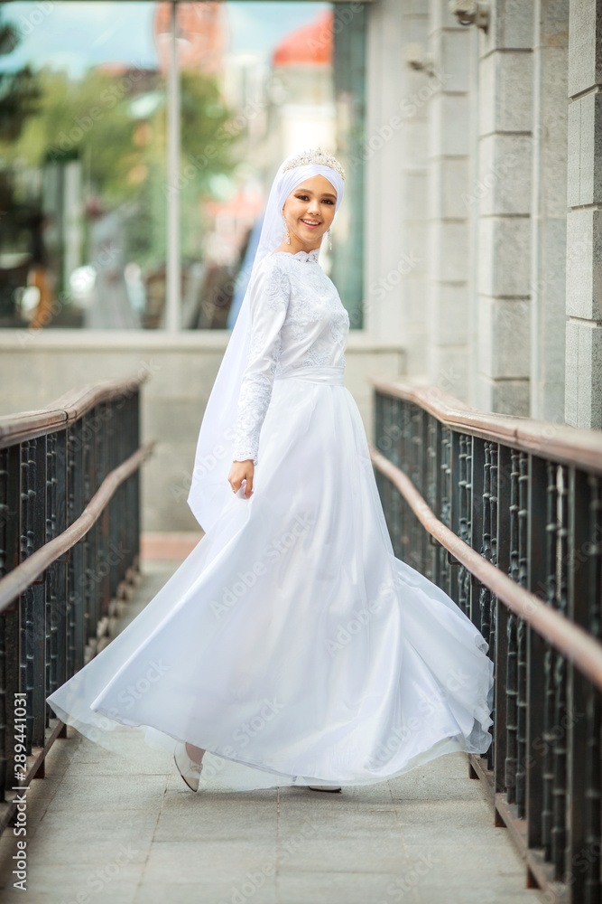 beautiful young woman in traditional islamic white dress beautiful young woman in traditional islamic white dress