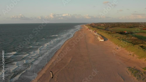 Kitesurfers near the beach of Domburg during sunset. Aerial shot.