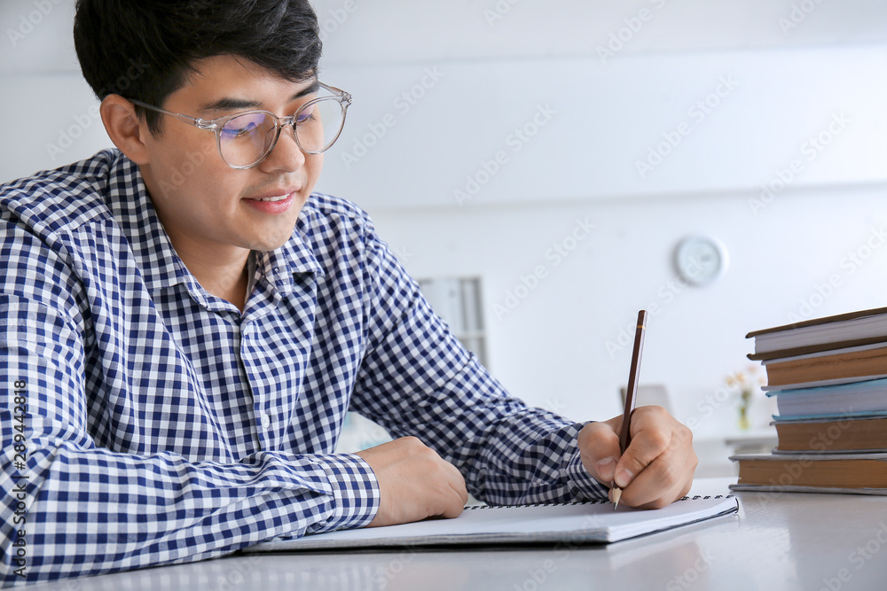 Asian student preparing for exam at home Asian student preparing for exam at home