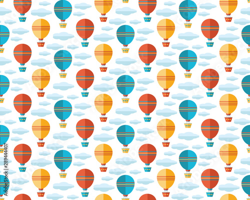 Seamless pattern in flat vector. Yellow, blue and red air balloon, aerostat flying in the sky among the clouds. Travel by air. Fun, kids background for textile, fabric, wrapping