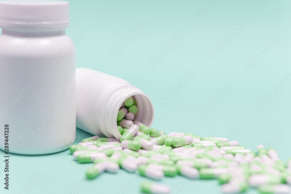 Pills spilling out of pill bottle. Pharmaceutical industry. Pharmacy. Pills spilling out of pill bottle. Pharmaceutical industry. Pharmacy.
