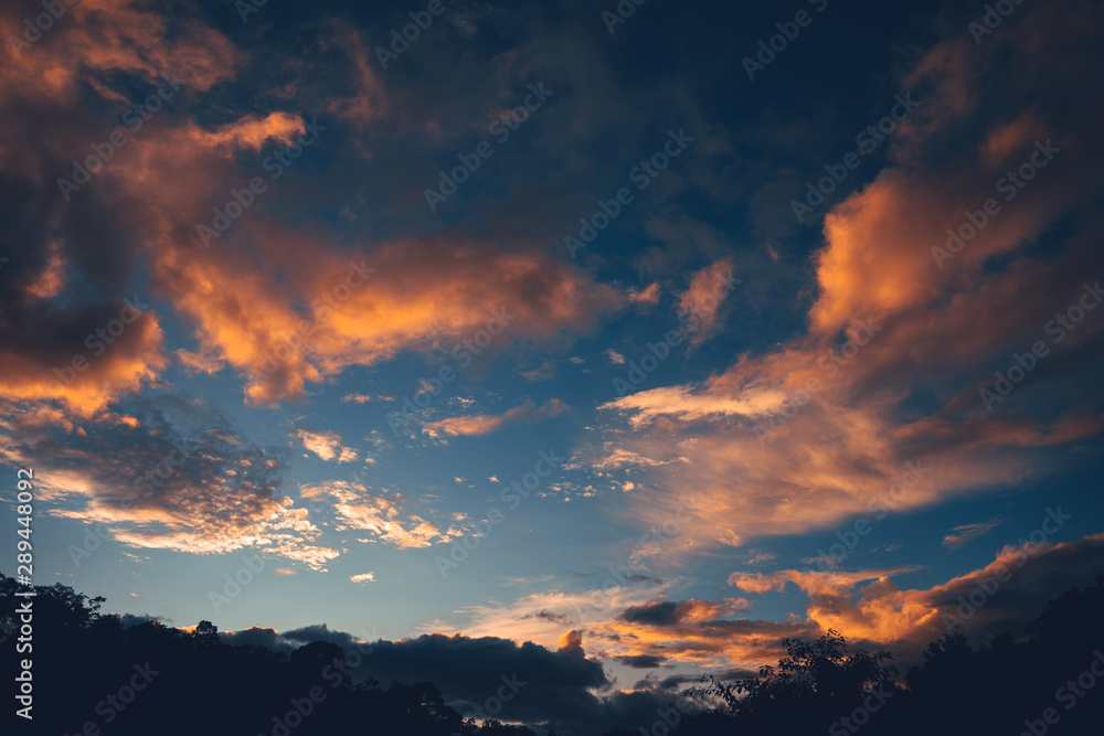 Evening sky, orange clouds and blue sky