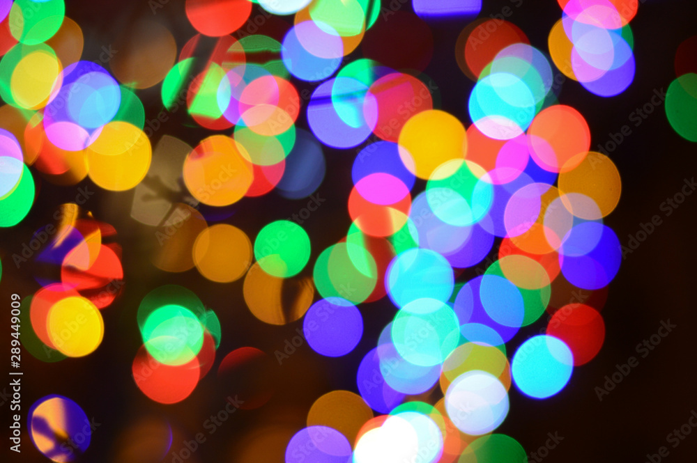 background of glittering shine bulbs, blurred circular defocused reflections of Christmas lights