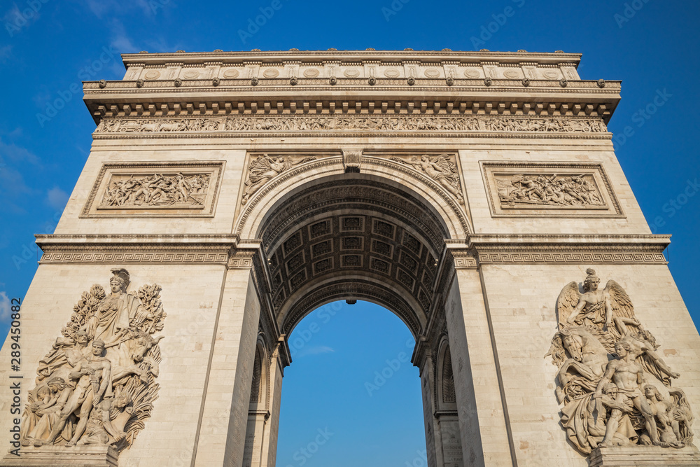 Low angle shot the Arc de Triomphe, Paris France, at the center of Place Charles de Gaulle, formerly named Place de l'Etoile