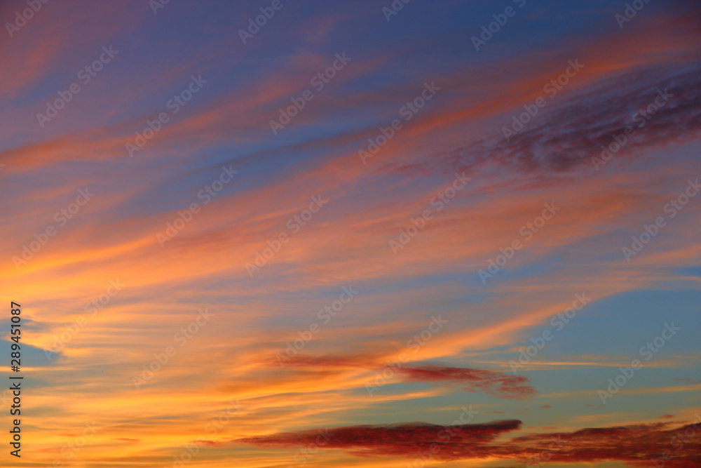 Fototapeta premium Orange sunset before night. Twilight with bright sunset. Evening landscape