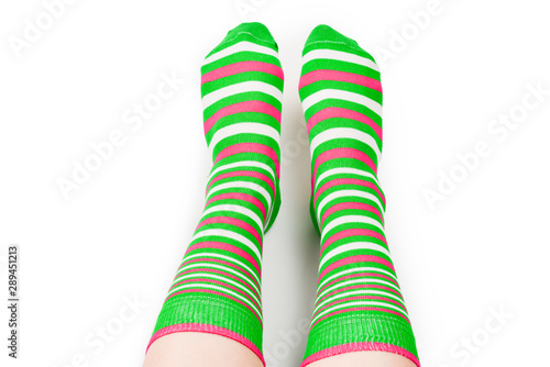 Woman in green socks isolated on white background. Top view.