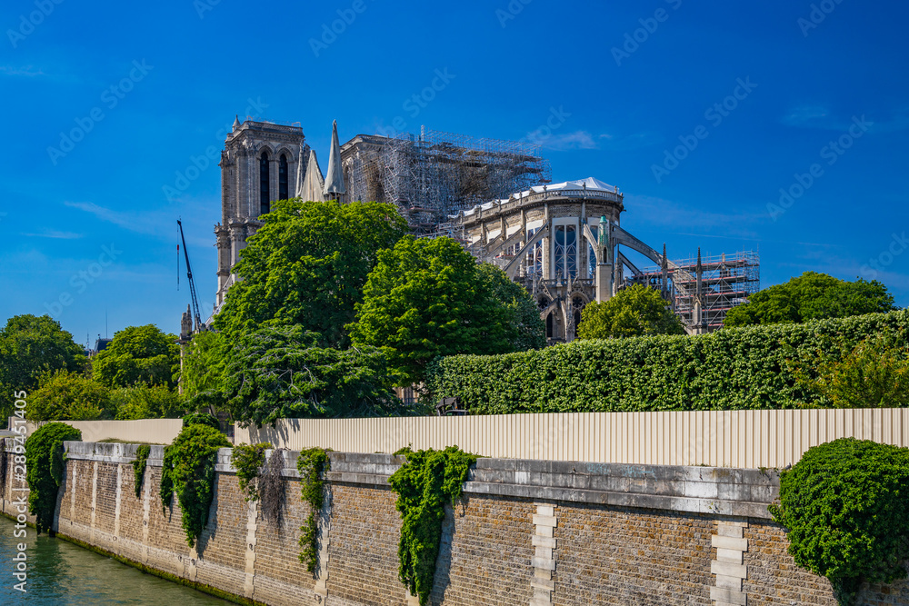 Fototapeta premium Notre Dame de Paris reconstruction, scaffoldings and work in progress after the fire destroyed the cathedral on 15 April 2019