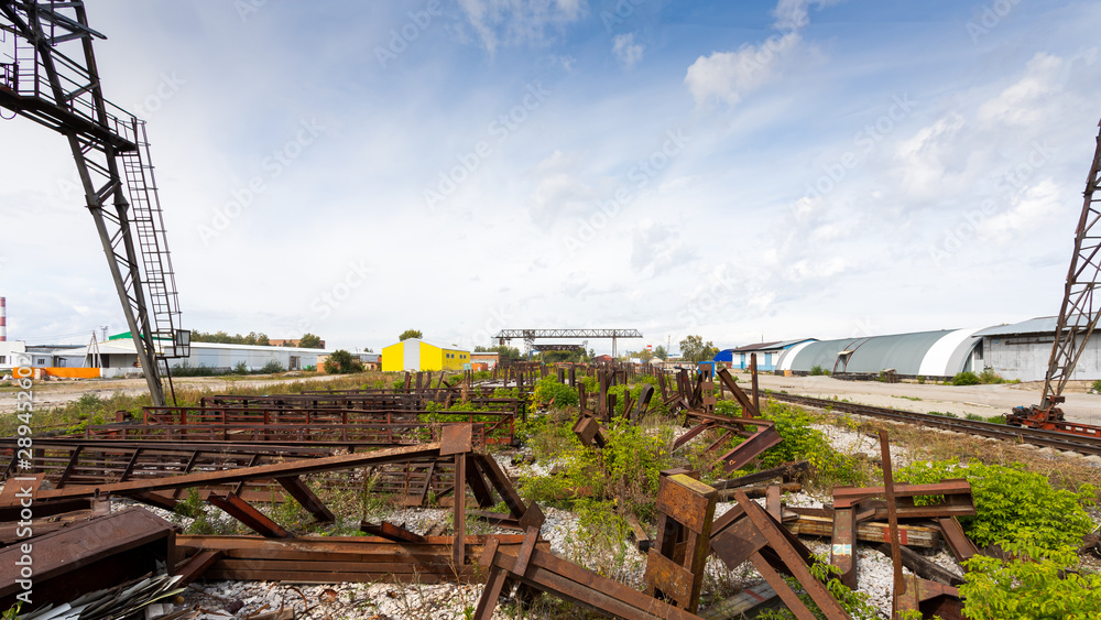 metal structures on the background of a construction site, manufactured workshop, warehouse, gantry crane. Industrial building concept metal structures on the background of a construction site, manufactured workshop, warehouse, gantry crane. Industrial building concept