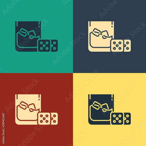 Color Game dice and glass of whiskey with ice cubes icon isolated on color background. Casino gambling. Vintage style drawing. Vector Illustration