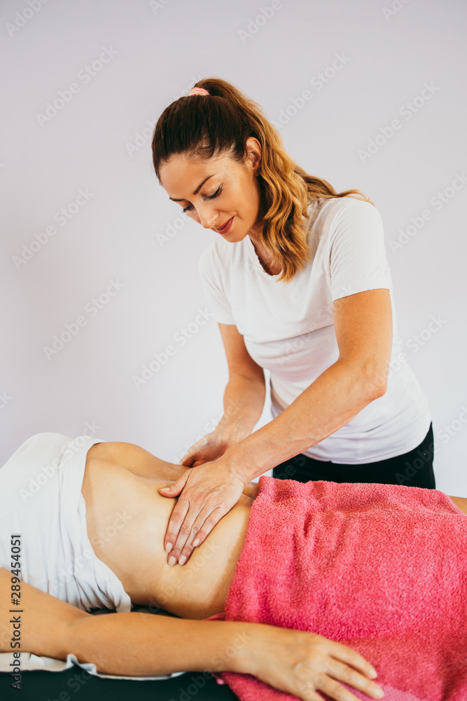Middle age woman at anti cellulite massage treatment. Close up shot. Middle age woman at anti cellulite massage treatment. Close up shot.