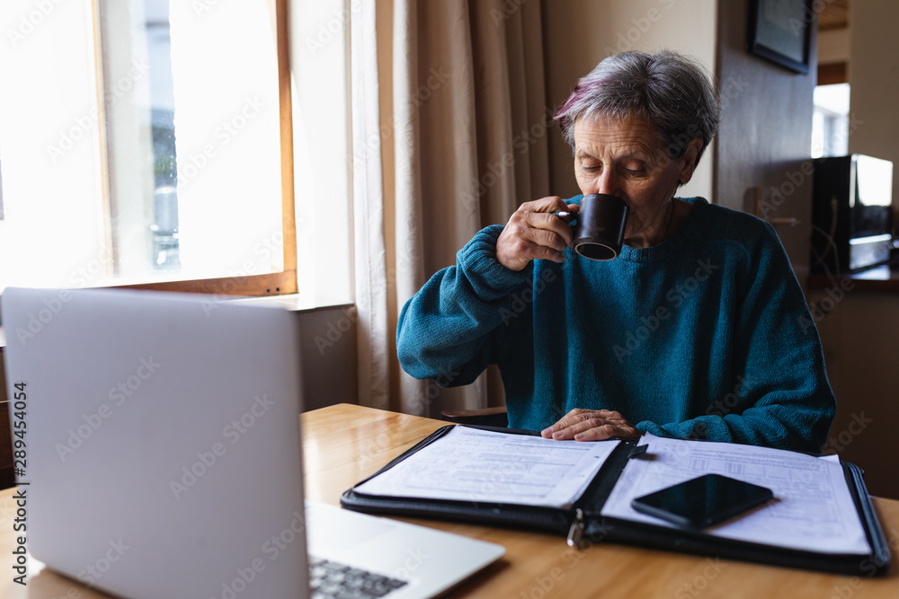 Senior woman drinking coffee at home Senior woman drinking coffee at home