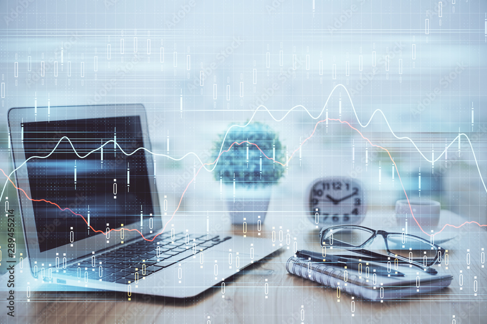 Stock market chart hologram drawn on personal computer background. Double exposure. Concept of investment. Stock market chart hologram drawn on personal computer background. Double exposure. Concept of investment.