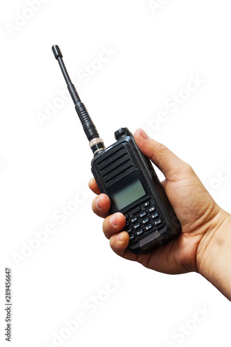 Black portable walkie-talkie radio on hand isolated  white background with cilpping path.