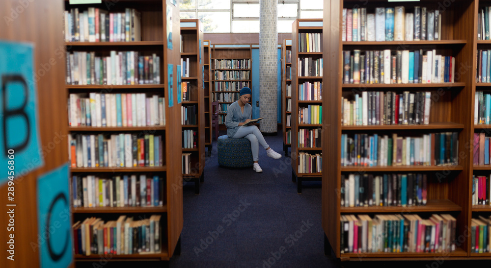 Young woman studying in library Young woman studying in library