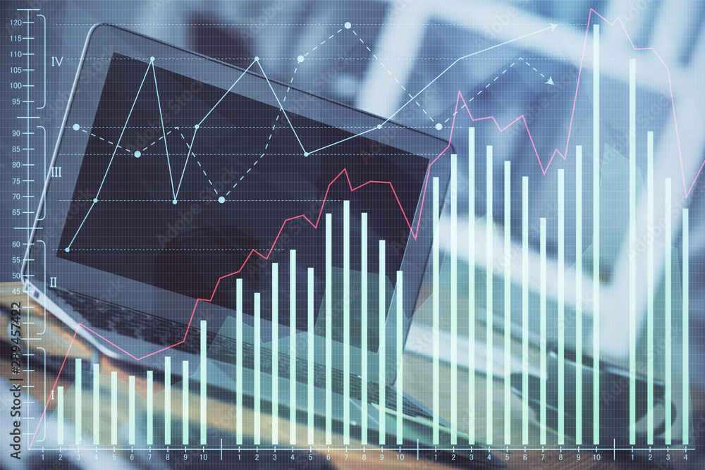 Financial graph colorful drawing and table with computer on background. Double exposure. Concept of international markets.