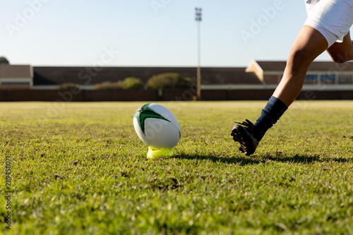 Young adult female rugby player on a rugby pitch photo