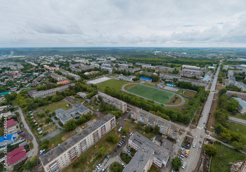 Stadium in Sukhoy Log city. Aerial, summer, cloudy day Stadium in Sukhoy Log city. Aerial, summer, cloudy day