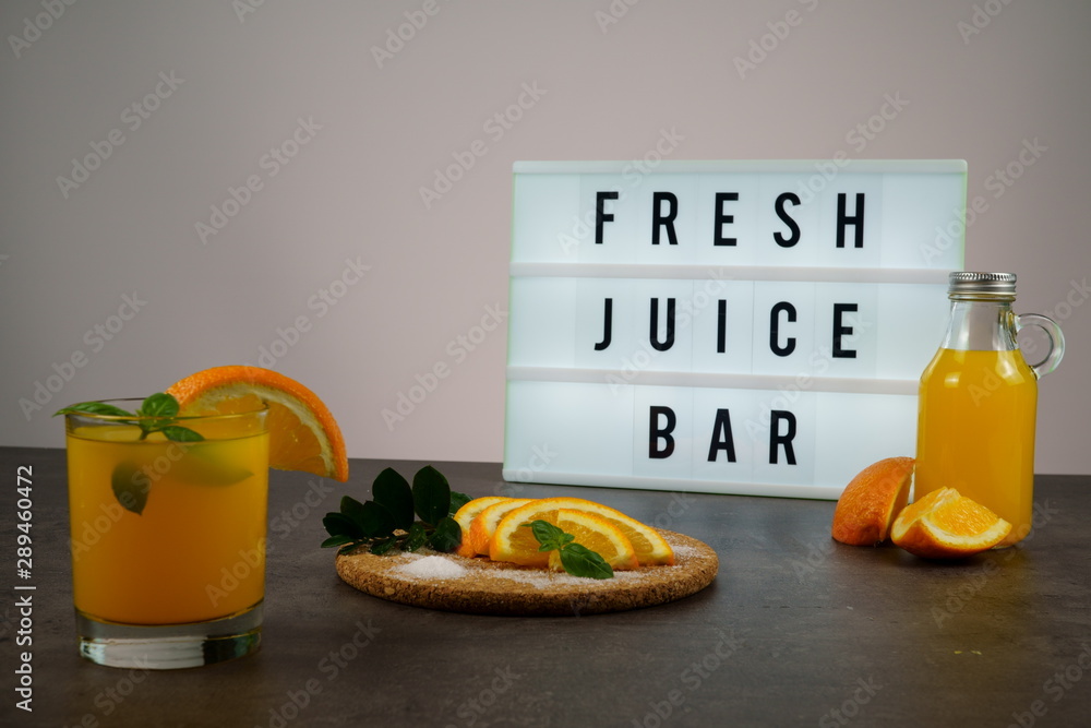 Fresh juice bar concept. Oranges with fresh orange juice Stock Photo |  Adobe Stock