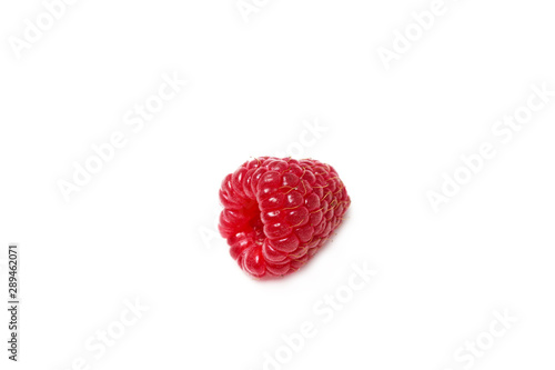 One red fresh ripe raspberry isolated on a white background. Macro. Large frame. At an angle. Foreground.