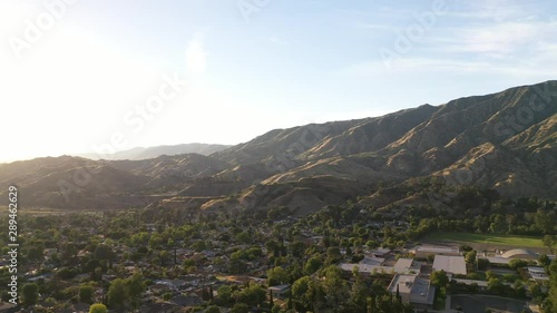 Beautiful aerial pan view of the mountains and town photo