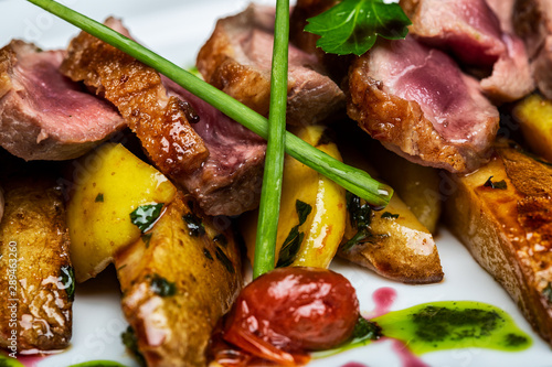 Gourmet roast beef dish with rare meat and extreme detail.