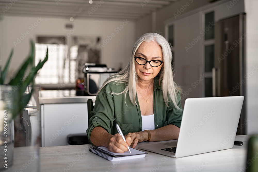 Senior fashionable woman working at home Senior fashionable woman working at home