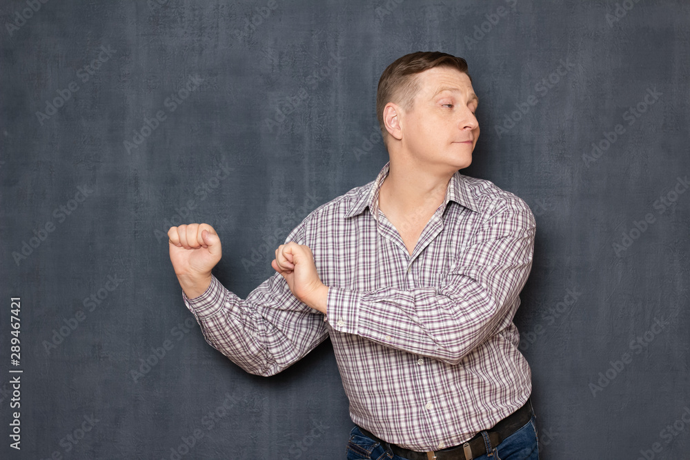 Portrait of happy joyful carefree man smiling and dancing