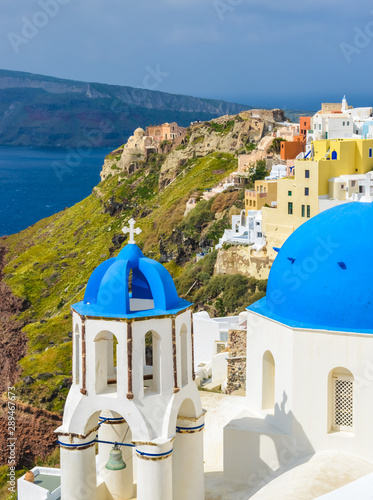 Fototapeta Naklejka Na Ścianę i Meble -  Classic Santorini scene with famous blue dome churches