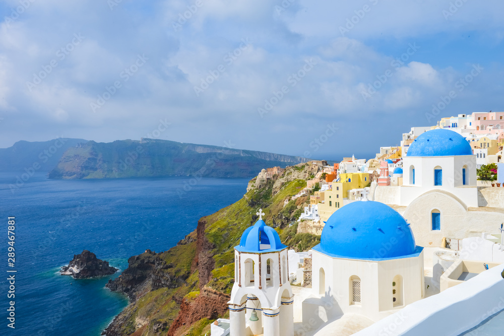 Classic Santorini scene with famous blue dome churches