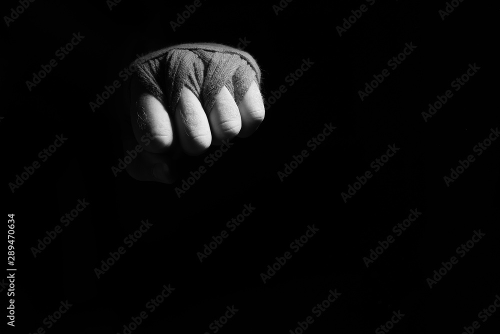 boxer with gloves on a dark background boxer with gloves on a dark background
