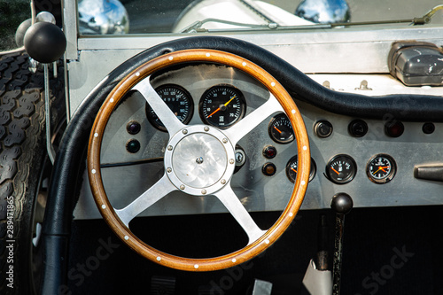 Close Up of Oldtimer Wooden Wheel and Dashboard