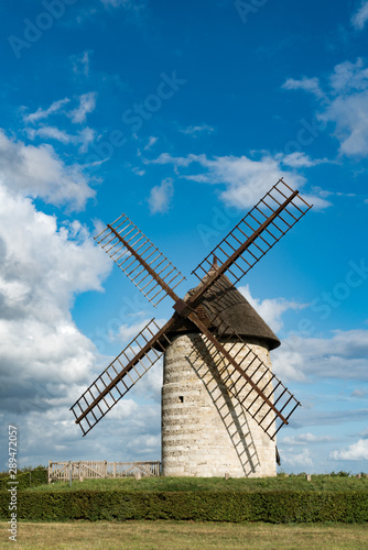 vertical view of the historic windmill Moulin de Pierre in Hauville in Normandy