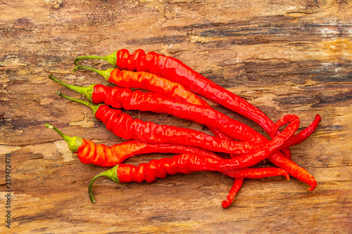 Red and orange chili pepper with garlic cooking food background