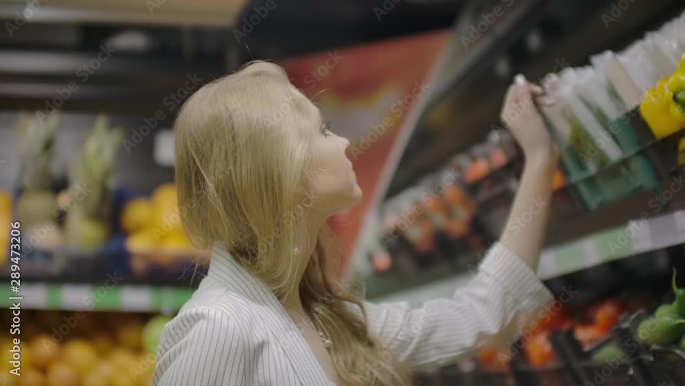 Woman Buying Yellow Pepper in Supermarket. Female take and Choosing Organic Vegetables in Grocery Store. Zero Waste Shopping and Healthy Lifestyle Concept. Slow motion Woman Buying Yellow Pepper in Supermarket. Female take and Choosing Organic Vegetables in Grocery Store. Zero Waste Shopping and Healthy Lifestyle Concept. Slow motion