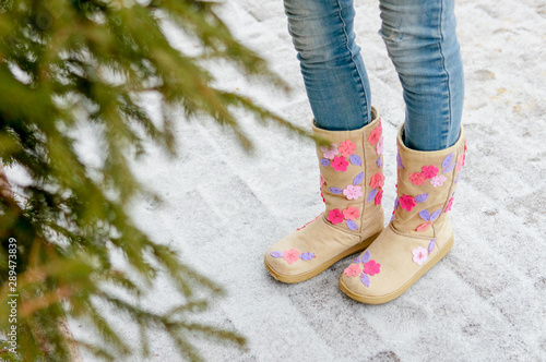 Legs of a girl on a winter walk