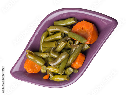 green beans with garlicand carrots  on a plate isolated on white background.green beans with carrot top view. healthy  food photo