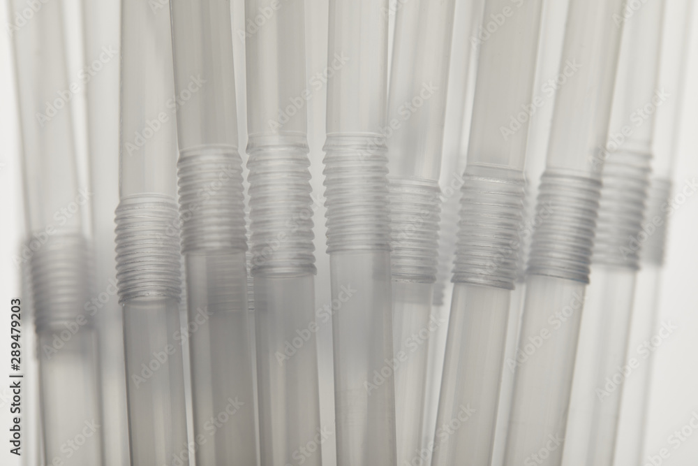 close up view of transparent plastic straws close up view of transparent plastic straws