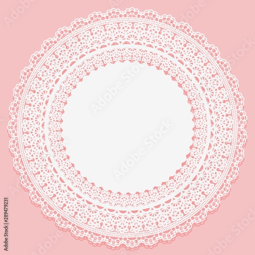 White lace serviette on a pink background. Openwork vintage round frame.