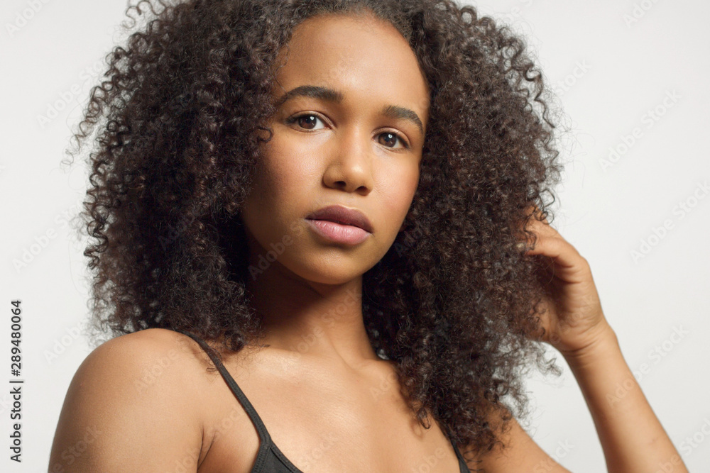 Stockfoto closeup portrait of young mixed race model with curly