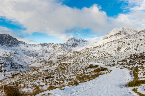 Snow covered mountain range in snowdonia, wales, United Kingdom. © valdisskudre