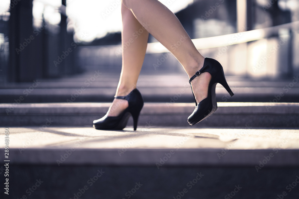 Woman walking in high heels in urban city street in summer. Chic stylish  footwear. Elegant fashion style. Business lady with sexy stiletto shoes.  Confident and powerful female boss. Luxury lifestyle. foto de