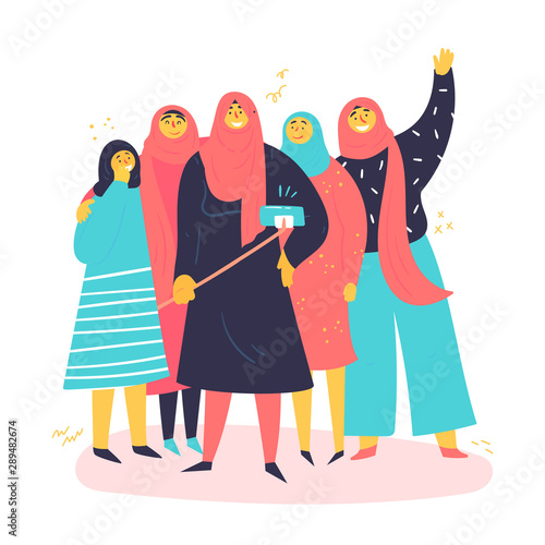 A group of Muslim women are taking selfies in hijab. Young contremporary, modern woman with phone stand together. Concept of equal rights and empower for all women. Be free