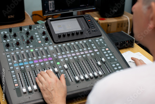 the mixer. remote for sound recording. sound engineer at work in the studio. sound amplifier mixing console equalizer. DJ