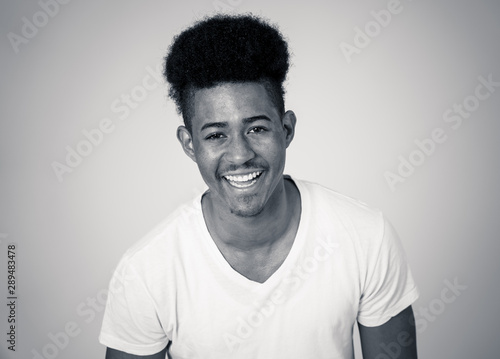 Wallpaper Mural Smiling and laughing attractive african american man in happy face human emotion and expression Torontodigital.ca